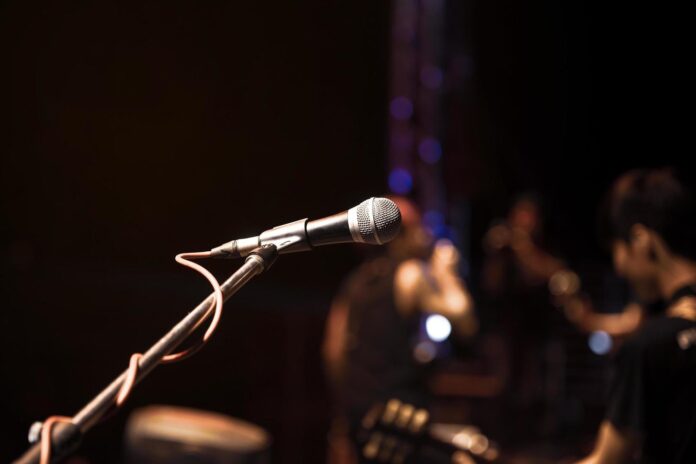 a-microphone-and-musicians-free-photo